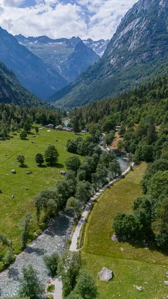 stock image Aerial view of Val di Mello, a green valley surrounded by granite mountains and woods, renamed the Italian Yosemite Valley by nature lovers. Val Masino, Valtellina, Sondrio. Italy