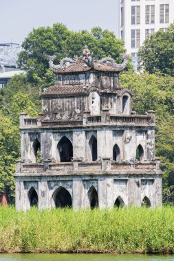 Hanoi, Vietnam: view of the Turtle Tower (Thap Rua), a small tower built in 1886 in the middle of Sword Lake (Hoan Kiem Lake), dedicated to the hero Le Loi, one of the symbol of the city clipart