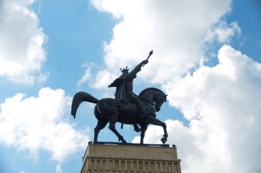 Majestic Equestrian Statue of Stephen the Great (Stefan cel Mare) Against a Clear Blue Sky, Suceava, Romania clipart