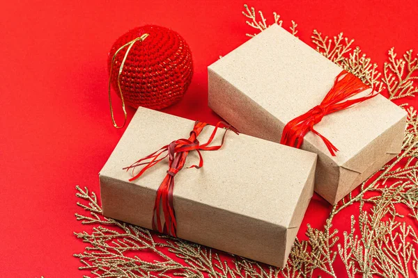 Christmas festive gift boxes, surprise concept. New Year background in red and gold colors. Traditional decor, flat lay, minimalistic design, copy space