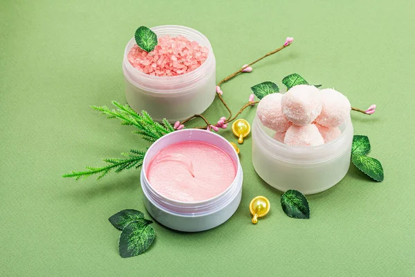 Wellness and spa composition with pink natural ingredients. Beauty organic cosmetic skincare background. Trendy savannah green color, flat lay, copy space