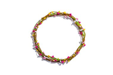 Easter wreath isolated on white background. Artificial floral decor, traditional festive symbol. Trendy hard light, dark shadow, top view, mockup, template, flat lay