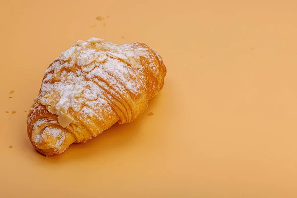 Good morning concept. Fresh croissants with cream filling and almond flakes. Sweet dessert, deconstruction, selective focus, flat lay, copy space