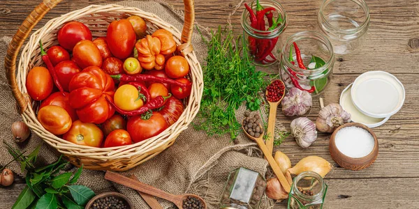 Preserved season vegetable concept. Harvest of tomato, chili, greens, onion and garlic. Ingredients for swicy canned food, cooking process. Healthy recipes, home cuisine, banner format