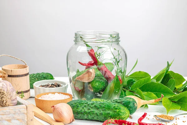 Preserved season vegetable concept. Harvest of cucumber, chili, greens, onion and garlic. Ingredients for swicy canned food, cooking process. Healthy recipes, home cuisine, copy space