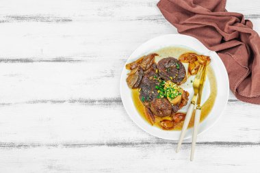 Ossobuco beef meat with spices and fresh herbs. Veal shank steak, traditional Italian ingredient for cooking healthy food. White wooden background, top view clipart