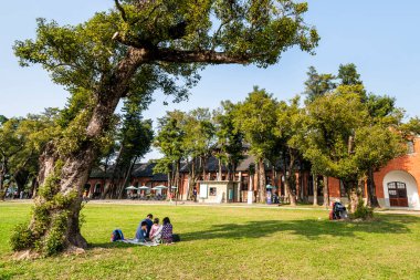 Tainan, Taiwan- January 19, 2020: Tourists visit the Shanshang Garden and old Watercourse Museum in Tainan, Taiwan. clipart