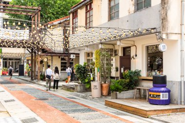 Taichung, Taiwan- October 5, 2021: Tourists are visiting the Shenji New Village in Taichung, Taiwan. It was redeveloped into a cultural and creative center. clipart