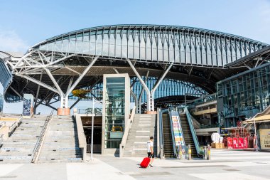 Taichung, Taiwan- October 6, 2021: Modern building view of the Taichung railway station in Taiwan. The Taiwan Railways Administration serves it. clipart