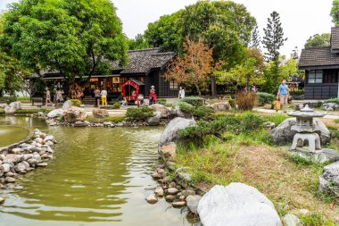 Chiayi, Taiwan- December 9, 2021: Tourists are visiting the Hinoki Village (cypress forest life village) in Chiayi, Taiwan. clipart