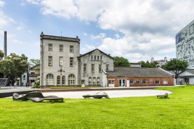 Taipei, Taiwan- August 27, 2021: Building view of the Huashan 1914 Creative Park in Taipei, Taiwan. The former Taipei winery has been redeveloped as a cultural and creative center. clipart