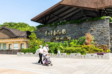 Taipei, Taiwan- August 27, 2021: Tourists visit the Taipei Muzha Zoo in Taiwan. It is the most famous zoological garden in Taiwan and a leader in conservation, research, education, and recreation. clipart