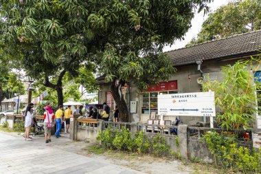 Pingtung, Taiwan- April 29, 2022: Tourists visit the Duxingshi Village Cultural Park in Penghu, Taiwan. which used to be a military dependents' village, is now a cultural and creative park. clipart