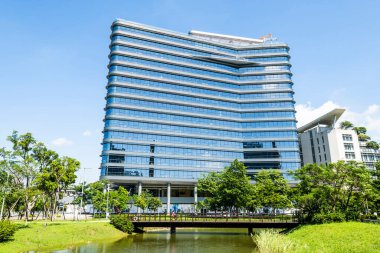 New Taipei City, Taiwan- July 11, 2022: Building view of the Taipei Far Eastern Telecom Park (Tpark) in New Taipei City, Taiwan. clipart