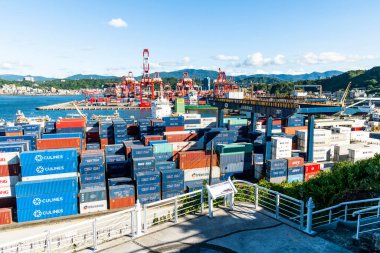 Keelung City, Taiwan- August 14, 2022: Panoramic view of the container yard and crane equipment at Port of Keelung, Taiwan. It's an international logistics company. clipart