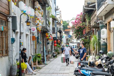 Tainan, Taiwan- September 10, 2022: Tourists visit Shennong Street in Tainan, Taiwan. its now a mecca for young art enthusiasts in Tainan. clipart