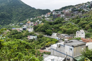 View of the old houses built along the mountains of Jiufen, New Taipei City, Taiwan. clipart