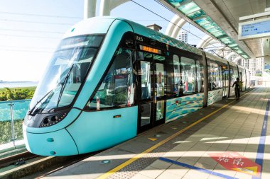 New Taipei City, Taiwan- November 22, 2023: The Danhai Light Rail transit (LRT) train stops at Binhai Yishan Station in New Taipei City, Taiwan.