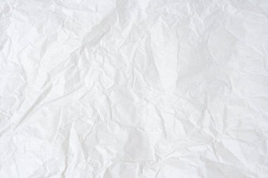 Crumpled white paper background texture with place for text