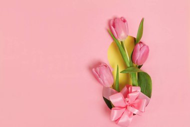 8 march Greeting card with tulips on pink background with copy space