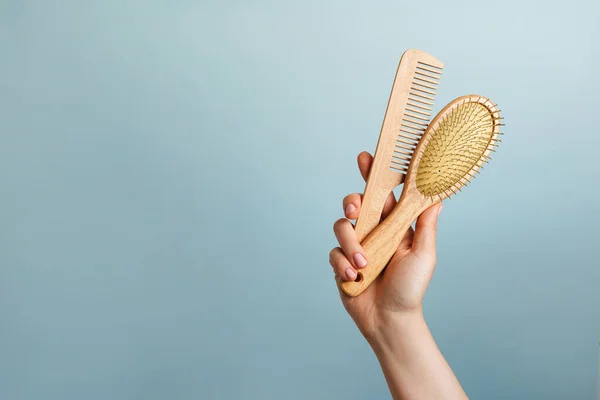 Woman Holding Two Wooden Hairbrushes Blue Background Hair Care Copy — Stock Photo, Image