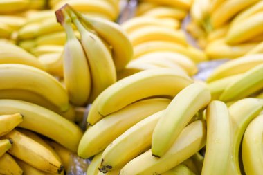 Fresh yellow bananas in the box on the fruit market