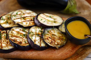 Grilled eggplant with mustard sauce.