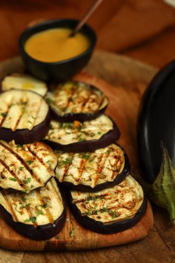 Grilled eggplant with mustard sauce.