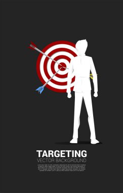 silhouette of businessman and arrow on center of dartboard. Business Concept of targeting and customer.Company vision mission.