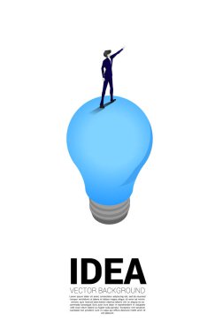 Silhouette of businessman standing and point on light bulb . Business Concept of creative idea and solution.