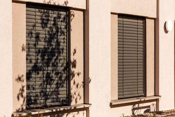 Shutters Outdoor External Blinds of Modern Exterior Design Building. Modern Venetian Blind on Windows Facade House