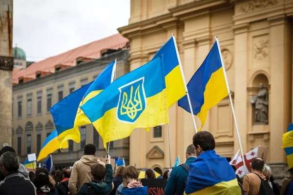 Munich, Bavaria, Germany - 05.08.22: Anti War Protest March Meeting with Ukraine Flags on Central Square of Munich, Germany