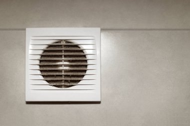 Air Vent with white Plastic Grate with Dust, Copy space. Layer of dust on Ventilation Grill