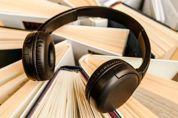 stock image Audio Book concept with large heap of Books and Headphones. Online Studying, Learning or Self Study. Book Day.