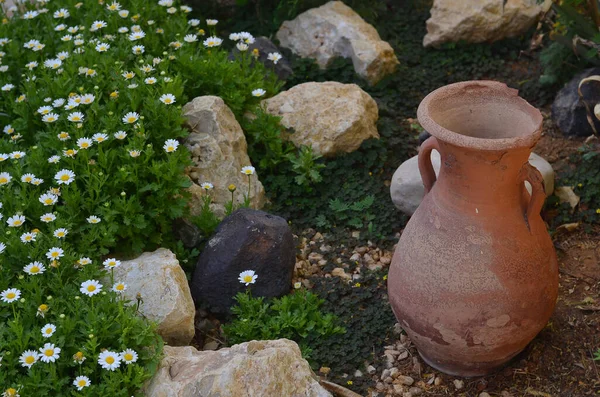 Broken Jar on a garden photo