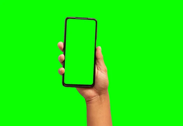 Hand Van Een Persoon Met Een Mobiele Telefoon Groene Achtergrond — Stockfoto