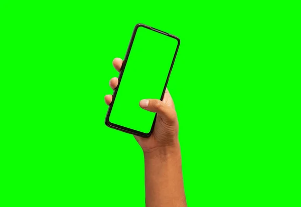 Hand Hält Ein Mobiltelefon Mit Grünem Hintergrund — Stockfoto