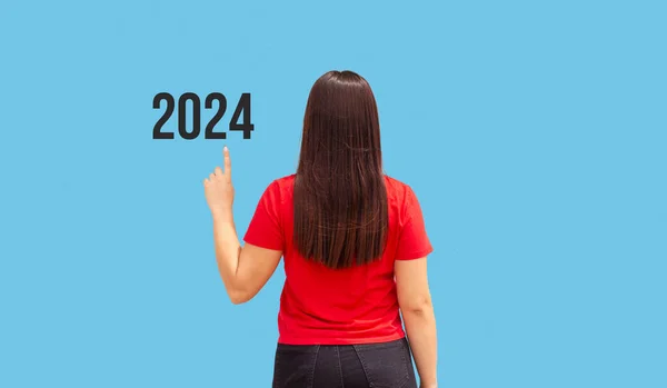 Beautiful Woman Pointing Year 2024 Blue Background — Stock Photo, Image