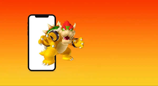 Bowser Super Mario Środku Nowego Telefonu Komórkowego Pomarańczowym Tle — Zdjęcie stockowe