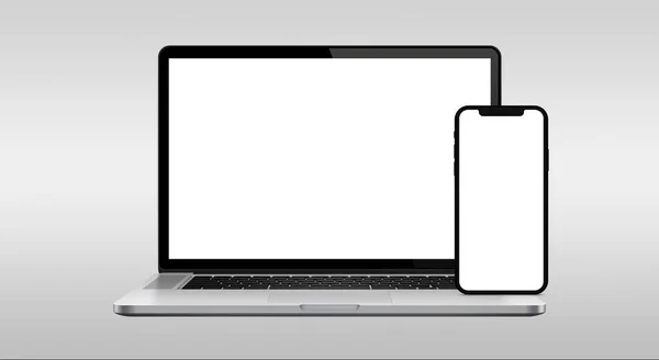 stock image last generation laptop and cell phone with white screen