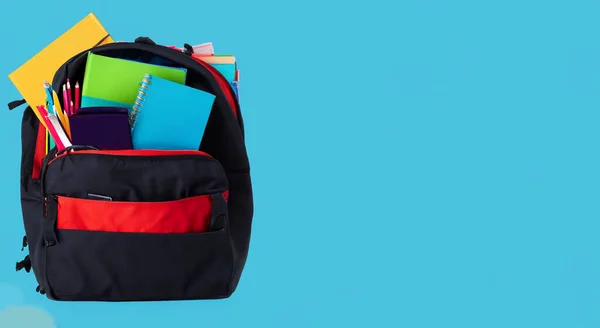 black bag with red school bag on blue background in high resolution