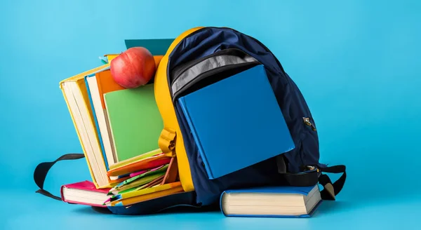 folders and books next to a school bag. college concept