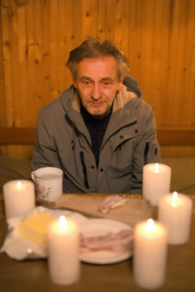 Senior Citizen Spending Evening Time His Small Candle Lit Cottage — Stock Photo, Image
