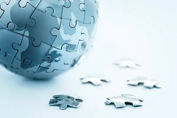 stock image Global strategy solution concept - earth jigsaw puzzle