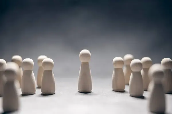 Stock image Leadership concept, wooden business team with one person standing out from the crowd