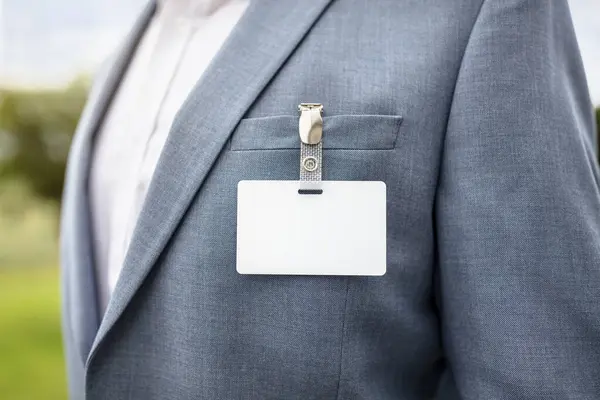 stock image Businessman at an exhibition or conference wearing a blank security identity name card or tag