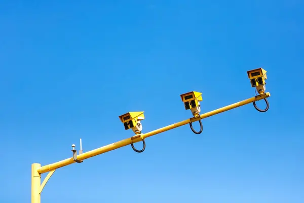 stock image Average traffic speed camera on motorway against a blue sky background