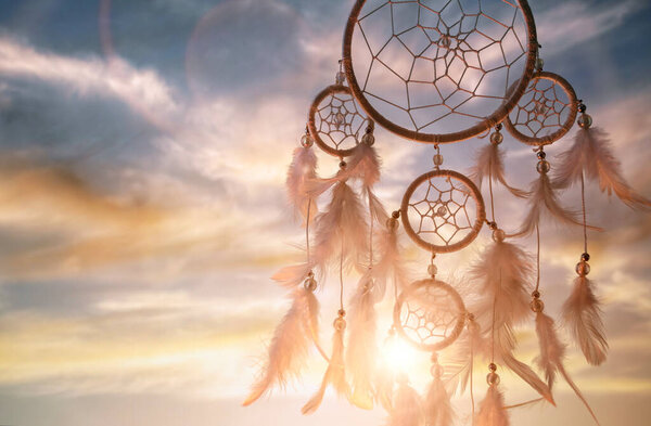 Dream catcher at sunset background with copy space