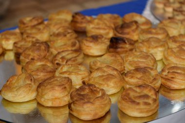 Tray of rustici leccesi, filled with bechamel, tomato and mozzarella. Typical Apulian specialty from the city of Lecce in Salento