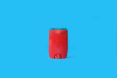 Male deodorant on a bright blue background. High quality photo